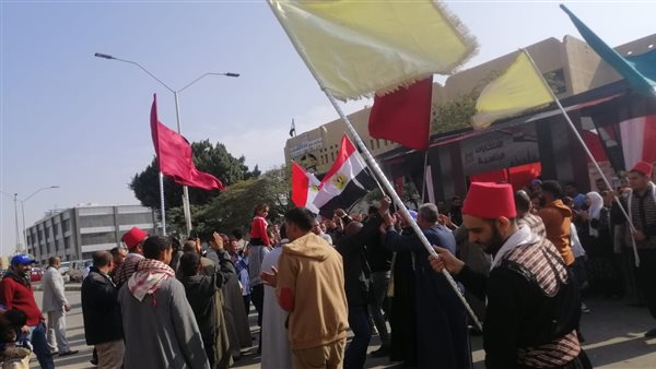 جينا نحيي فرحكم.. السوريون يغنون للمصريين أمام لجان أكتوبر| شاهد