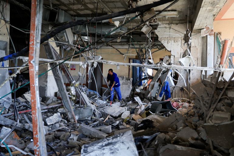 A person inspects Nasser Hospital a part of which was damaged in the aftermath of an Israeli strike, according to Gaza Health Ministry, in Khan Younis, in the southern Gaza Strip, May 13, 2025. REUTERS/Hatem Khaled TPX IMAGES OF THE DAY