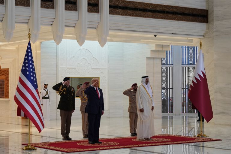 President Donald Trump and Qatar's Emir Sheikh Tamim bin Hamad Al Thani take part in an official welcoming ceremony at the Amiri Diwan in Doha, Qatar, Wednesday, May 14, 2025. (AP Photo/Alex Brandon