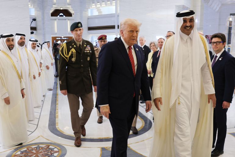 DOHA, QATAR - MAY 14: U.S. President Donald J. Trump participates in an arrival ceremony with Emir of Qatar Tamim bin Hamad al Thani at the Amiri Diwan, the official workplace of the emir, on May 14, 2025, in Doha, Qatar. The visit underscores the strategic partnership between the United States and Qatar, focusing on regional security and economic collaboration. (Photo by Win McNamee/Getty Images)