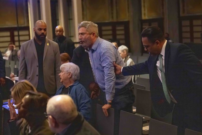 NEW YORK, UNITED STATES - MAY 29: New York Public Library security remove a protestor from inside the venue as multiple demonstrators disrupted United States Senator Chuck Schumer’s book signing event inside New York Public Library in New York, U.S., May 29, 2025