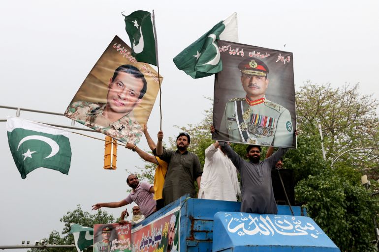 People carry posters in support of Pakistan Army, day after the ceasefire announcement between India and Pakistan, in Lahore, Pakistan, May 11, 2025. REUTERS/Mohsin Raza