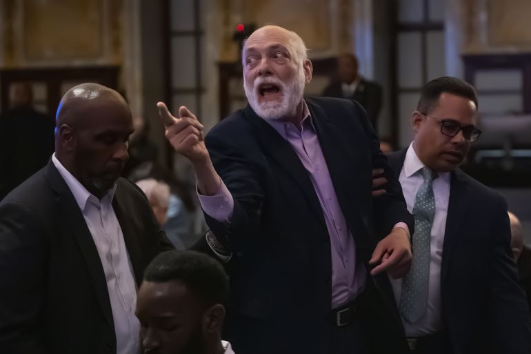NEW YORK, UNITED STATES - MAY 29: New York Public Library security remove a protestor from inside the venue as multiple demonstrators disrupted United States Senator Chuck Schumer’s book signing event inside New York Public Library in New York, U.S., May 29, 2025