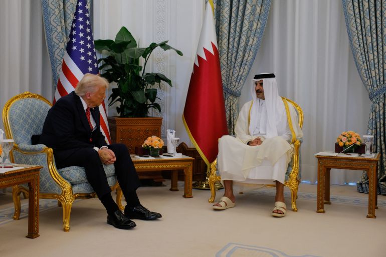 U.S. President Donald Trump meets Qatar's Emir Tamim bin Hamad Al Thani, in Doha, Qatar, May 14, 2025. REUTERS/Brian Snyder