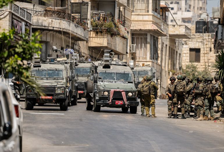 Israeli soldiers take part in an Israeli raid an Israeli raid in Nablus, the Israeli-occupied West Bank, June 10, 2025. REUTERS/Raneen Sawafta