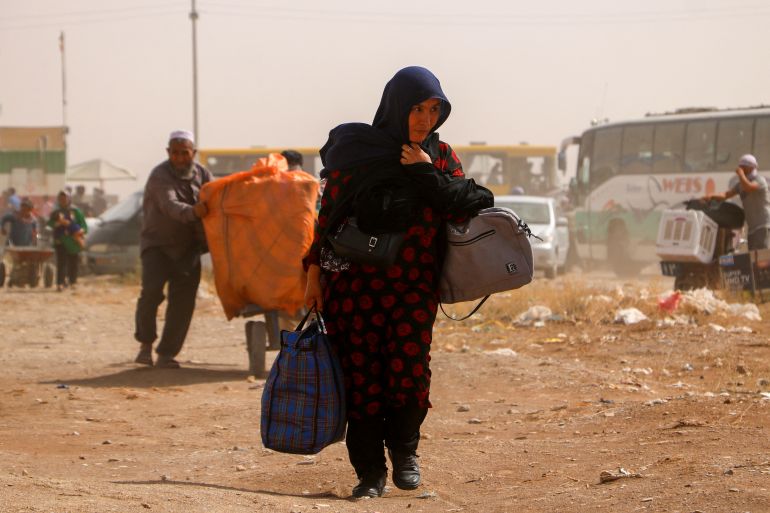 Afghan refugees arrive from Iran at Islam Qala border between Afghanistan and Iran, on July 5, 2025.
