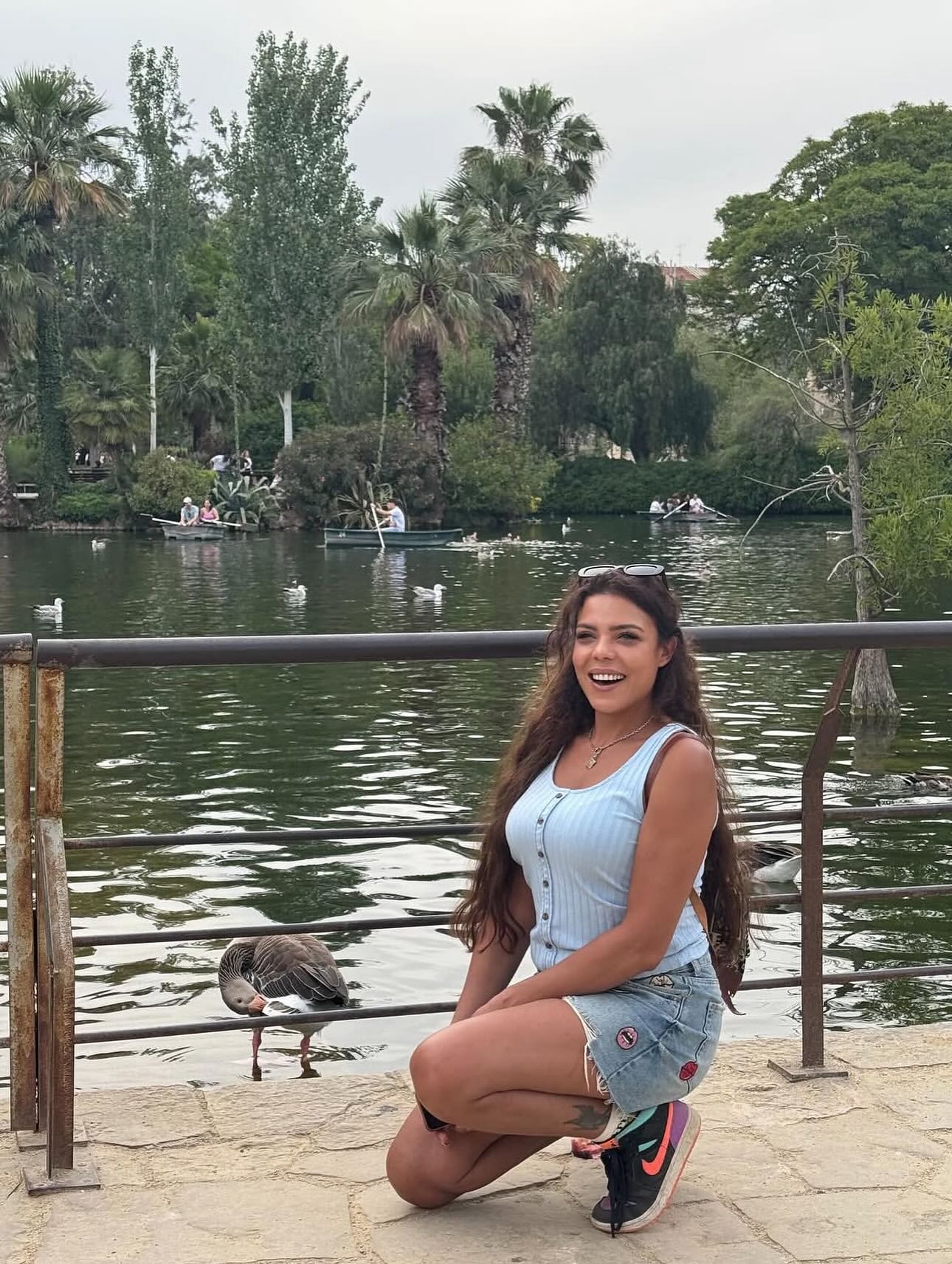 May be an image of 1 person and swan