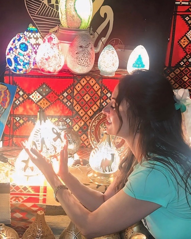 May be an image of 1 person, lighting and text