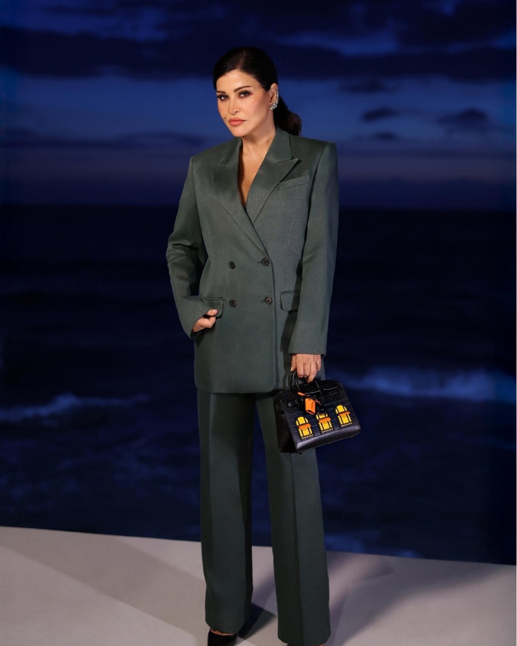 May be an image of 1 person and suit